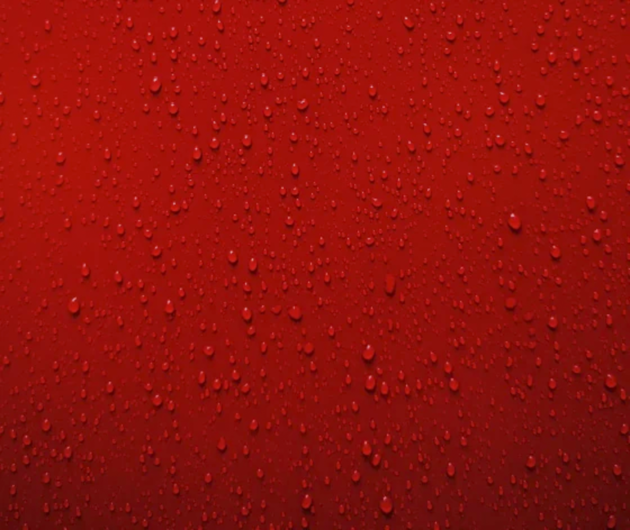 Water droplets on a red Silic One coated surface