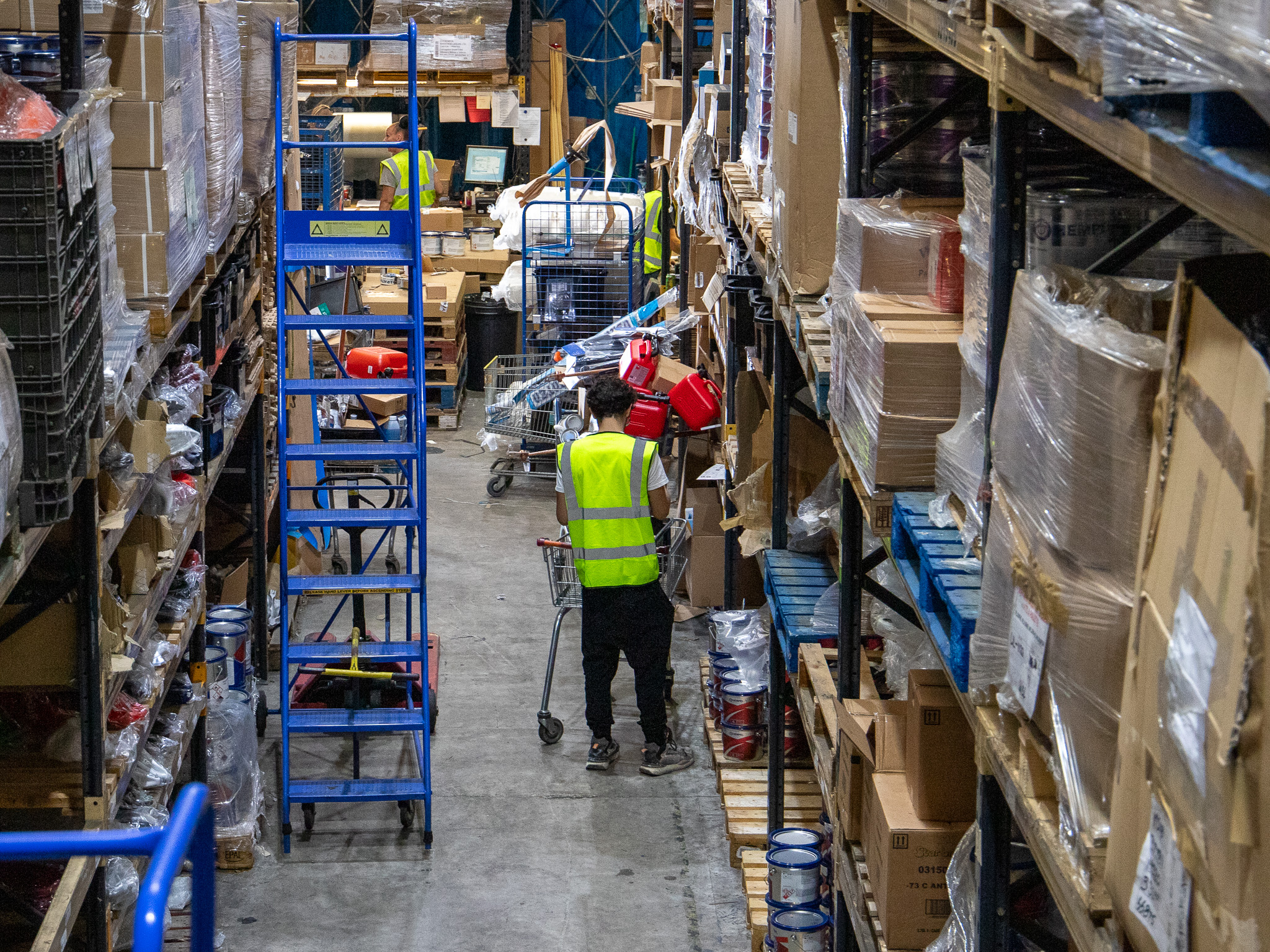 A team member picking products in the Marathon warehouse